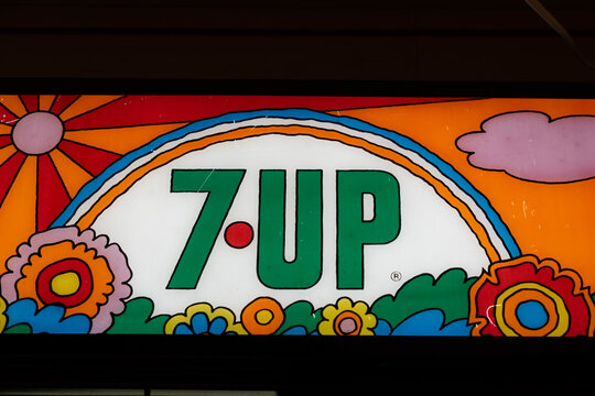 Arizona, USA - December 22, 2023: Lit up neon sign, retro logo for 7up soda pop