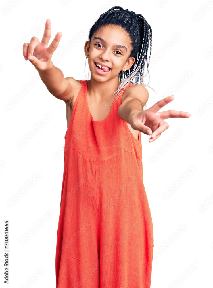 Sticker cute african american girl wearing casual clothes smiling with tongue out showing fingers of both ha