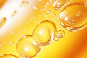 Golden yellow oil bubbles macro photography on white background.