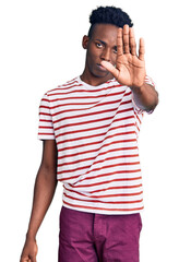 Young african american man wearing casual clothes doing stop sing with palm of the hand. warning...