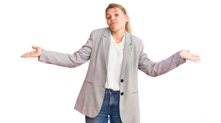 Young beautiful blonde woman wearing elegant jacket clueless and confused expression with arms and hands raised. doubt concept.