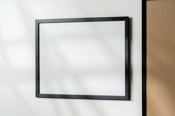 Blank picture frames on the white wall copy space