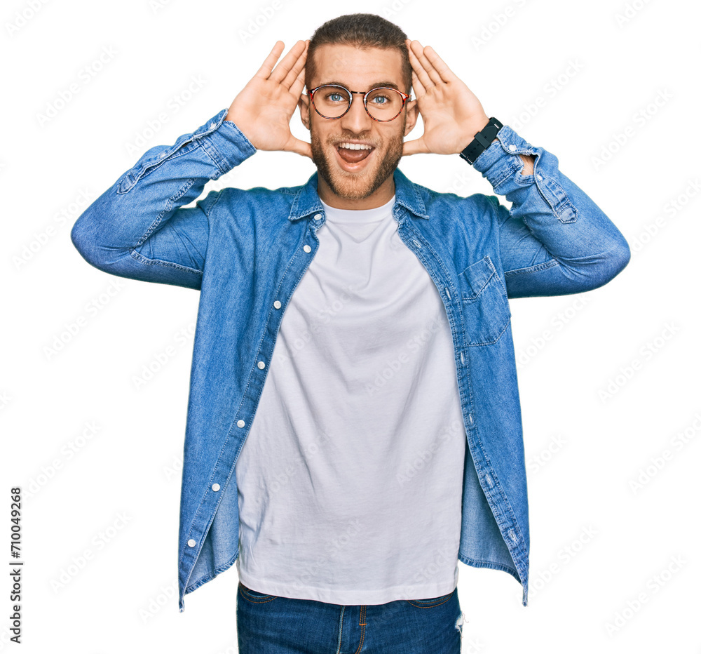 Poster young caucasian man wearing casual clothes smiling cheerful playing peek a boo with hands showing fa