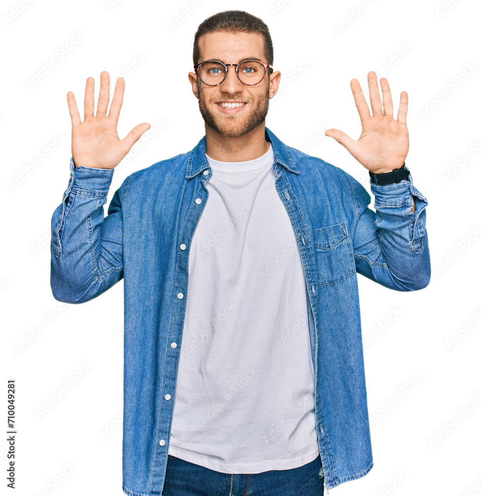 Poster Young caucasian man wearing casual clothes showing and pointing up with fingers number ten while smiling confident and happy.