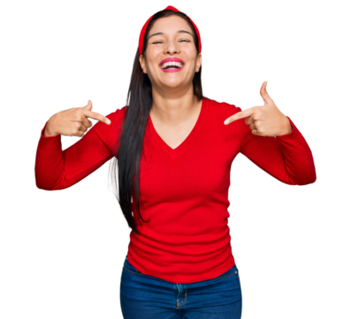 Young hispanic woman wearing casual clothes looking confident with smile on face, pointing oneself with fingers proud and happy.