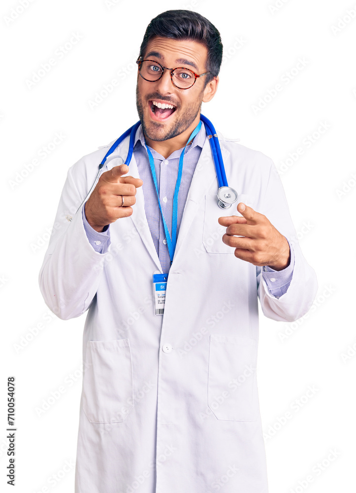 Wall mural young hispanic man wearing doctor uniform and stethoscope pointing fingers to camera with happy and 