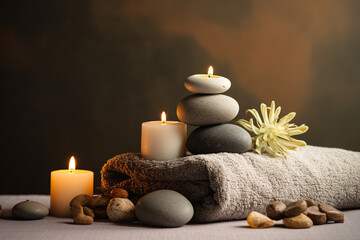Fototapeta na wymiar studio closeup image of candles stones and towels, Spa theme created with Generative Ai