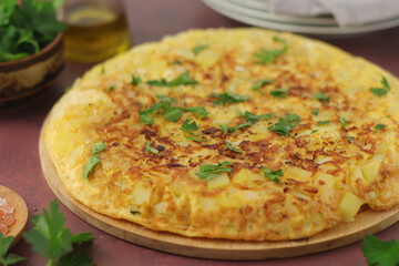 Frittata, traditional egg and potato omelette, Italian dish