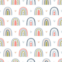 Delicate naive seamless vector pattern with cute rainbows and hearts on a white background.