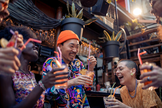 Diverse friends having drinks at a bar