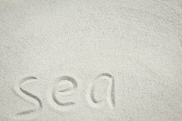 A drawing on the sand by the sea travel background
