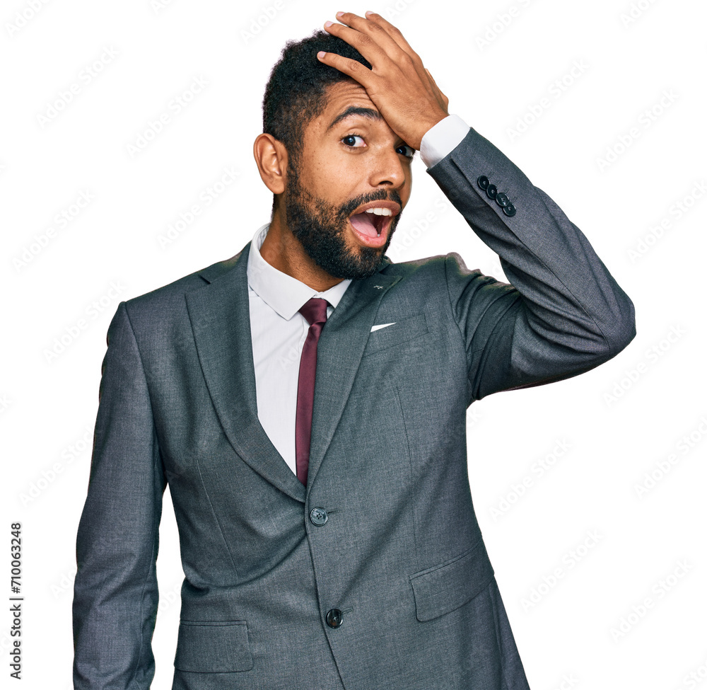 Sticker Young african american man wearing business clothes surprised with hand on head for mistake, remember error. forgot, bad memory concept.