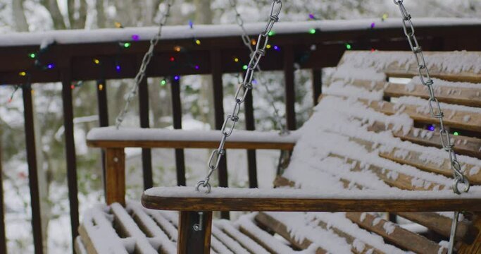 Snowy swing on porch