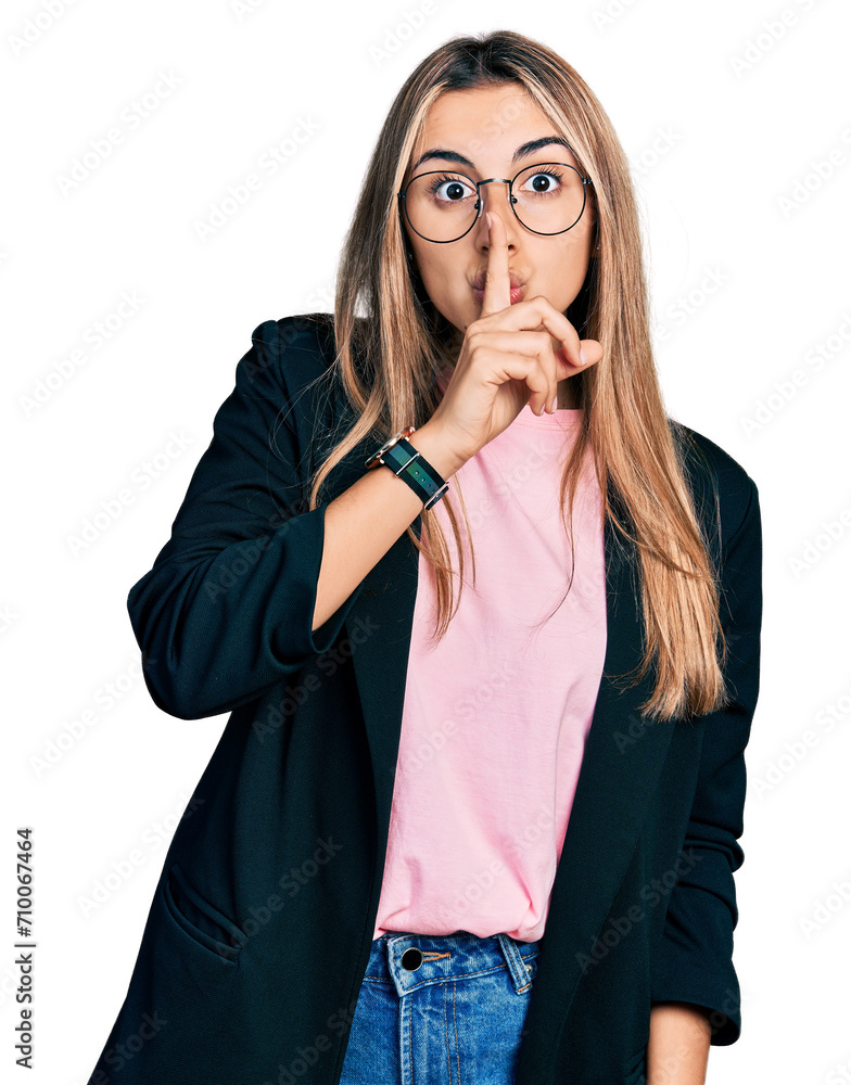 Canvas Prints Hispanic young woman wearing business jacket and glasses asking to be quiet with finger on lips. silence and secret concept.