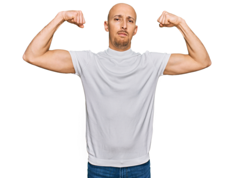 Bald man with beard wearing casual white t shirt showing arms muscles smiling proud. fitness concept.