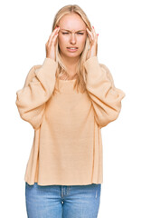 Young blonde girl wearing casual clothes with hand on head for pain in head because stress. suffering migraine.