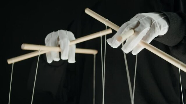 The puppeteer controls the puppets in the theater. Managing people at work, in politics and government. Action control