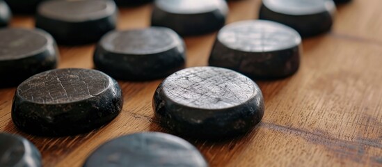 Close-up view of black and white stone pieces on Chinese Go game board, featuring AlphaGo.