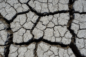 dry and cracked floor of dry river of caldera grande in the city of Barreiro. - obrazy, fototapety, plakaty