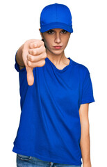 Young hispanic girl wearing delivery courier uniform looking unhappy and angry showing rejection and negative with thumbs down gesture. bad expression.