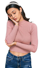 Young hispanic girl wearing casual clothes thinking looking tired and bored with depression problems with crossed arms.