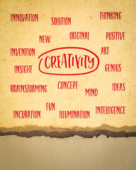 creativity concept - cloud of related words, handwriting on art paper