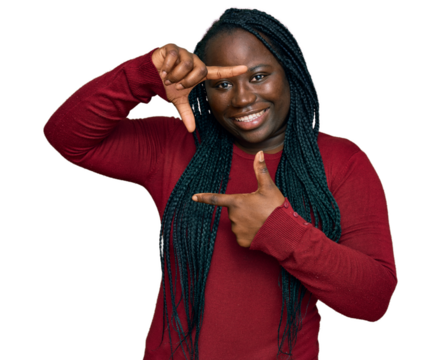 Young black woman with braids wearing casual clothes smiling making frame with hands and fingers with happy face. creativity and photography concept. - Powered by Adobe