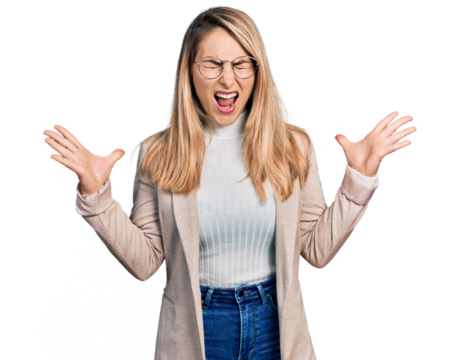 Young blonde woman wearing business shirt and glasses celebrating mad and crazy for success with arms raised and closed eyes screaming excited. winner concept