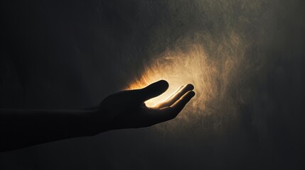 A conceptual photograph of a hand reaching out from the darkness towards a glowing light, symbolizing hope and uncertainty. The minimalistic composition and contrast of warm and cool tones.   - obrazy, fototapety, plakaty