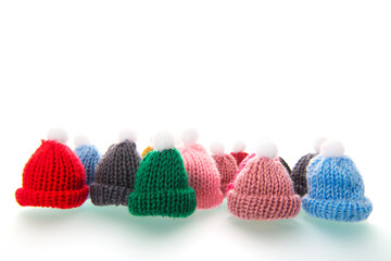 Colorful winter hats isolated over white background
