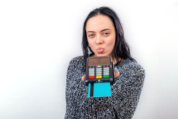 woman holds a payment terminal and shows her tongue