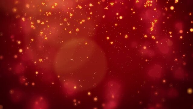Small confetti of hearts and small yellow glowing particles flying on red abstract romantic background. Looped motion graphics. Place for text.