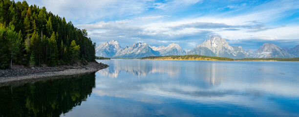 Grand Teton National Park reflected on a lake - Powered by Adobe