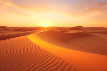 Fototapeta na wymiar Sunset over the desert of Al Khatim in Abu Dhabi Emirates. Golden Sand Dune Desert Landscape Panorama. Beautiful sunset over the sand dunes in the Al Khatim in Abu Dhabi Emirates