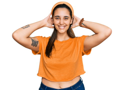 Young hispanic woman wearing casual clothes relaxing and stretching, arms and hands behind head and neck smiling happy