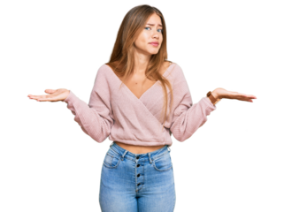 Beautiful blonde woman wearing casual winter pink sweater clueless and confused with open arms, no idea concept.
