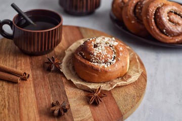 Traditional Swedish fika, cinnamon buns (kanelbullar) with coffee. 