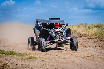 UTV buggy offroad vehicle racing on sand. Extreme, adrenalin. 4x4. © Antonio