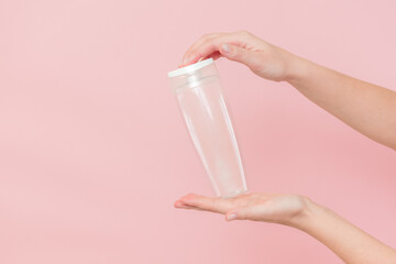 Female hand holds blank cosmetic container. Cosmetic beauty packaging