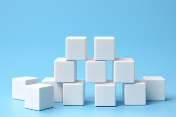 Pile of white cubes sitting on top of blue surface. Versatile image suitable for various concepts and designs.