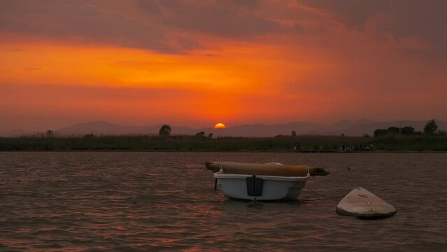 Silhouette of boat for surfing against sky. A view of silhouette of boat in the sea against colorful bright sky in summer.
