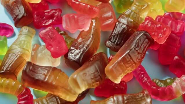 Jelly marmalade cola bottle bear close up, Confiture Bean candy jujube Marmalade bears with cod cannabis close up. 