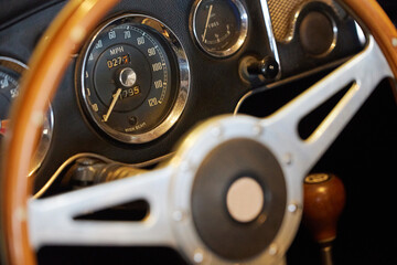 Steering wheel of vintage car at an antique car exhibition in Denmark