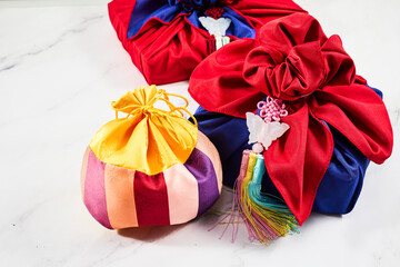 Happy Seollal, Korean New Year. Korean traditional wrapping decorated with silk and pendant