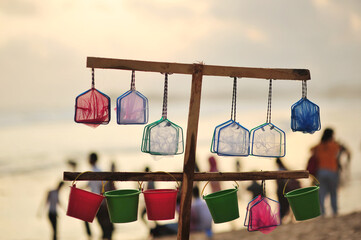 small nets and buckets for children's toys on the beach