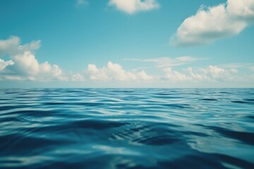 Obraz premium A scenic view of a body of water with clouds in the sky. Perfect for nature and landscape designs