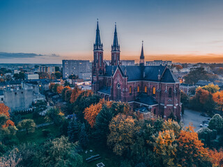 View at Pabianice city and Church of Our Lady of the Rosary from a drone at sunset
