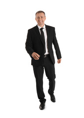 Mature businessman walking forward on white background
