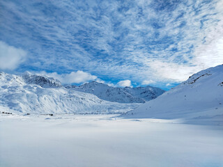 Fototapeta na wymiar Snowy landscape in the alps of Valchiavenna in Montespluga village