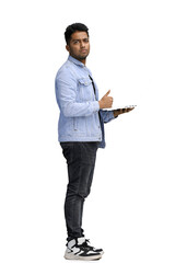 man on a white background. uses a laptop, in profile